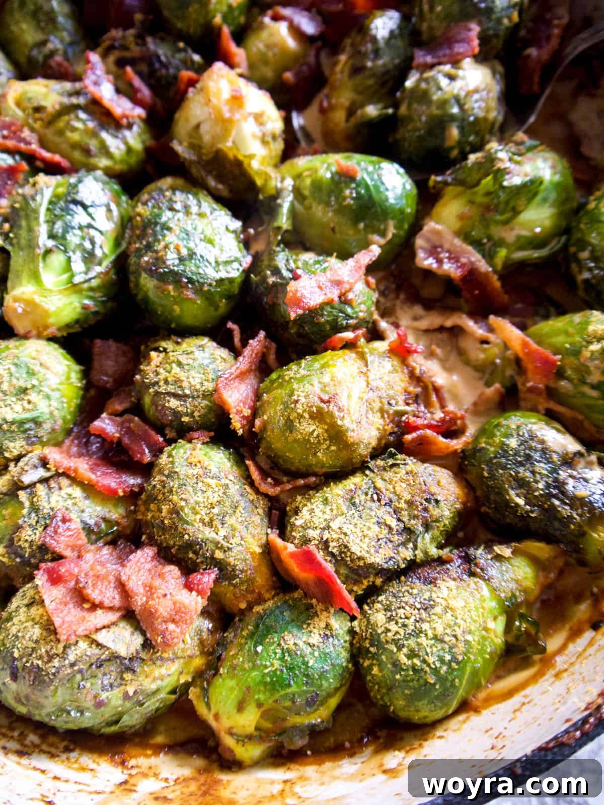 Paleo Whole30 Dairy Free Brussels Sprouts Casserole 3 A close-up shot of the creamy Brussel sprout casserole with crispy bacon pieces, just removed from the oven and steaming.