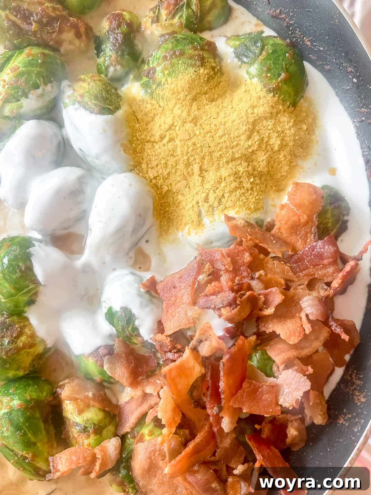 Paleo Whole30 Dairy Free Brussels Sprouts Casserole 8 All the creamy sauce ingredients, including coconut cream, bacon, and nutritional yeast, added to the cooked Brussels sprouts in the pan.