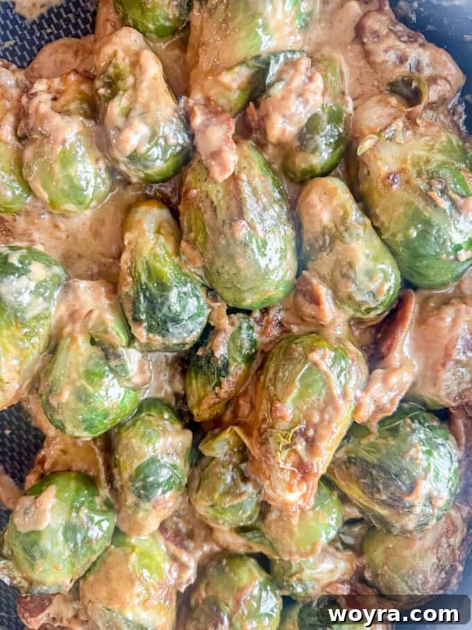 Paleo Whole30 Dairy Free Brussels Sprouts Casserole 9 The creamy sauce thoroughly mixed with the tender Brussels sprouts, creating a cohesive casserole mixture.