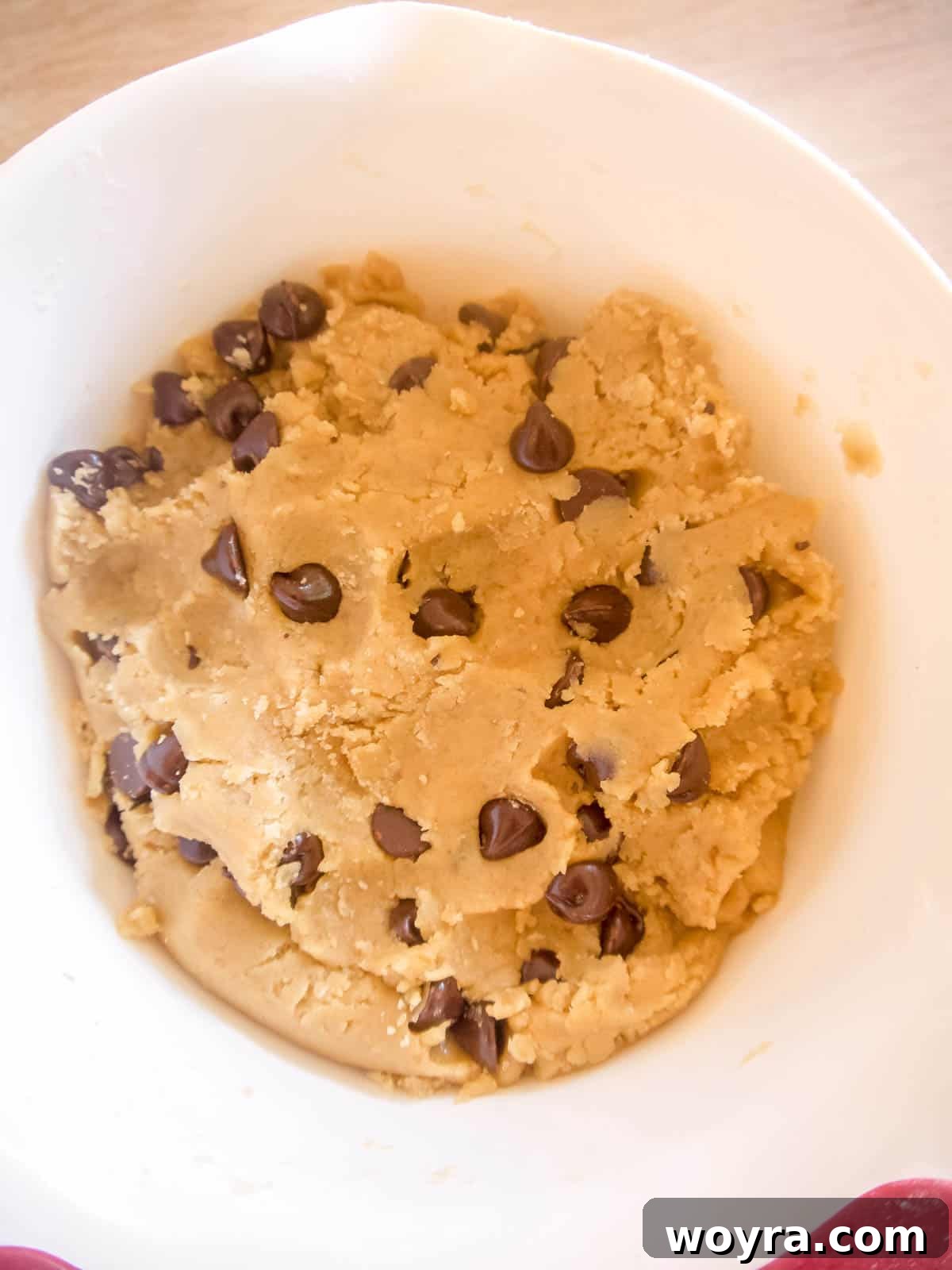 Mediterranean Chocolate Chip Jewels 6 Close-up of the finished olive oil chocolate chip cookie dough, studded with chocolate chips and ready to be scooped.