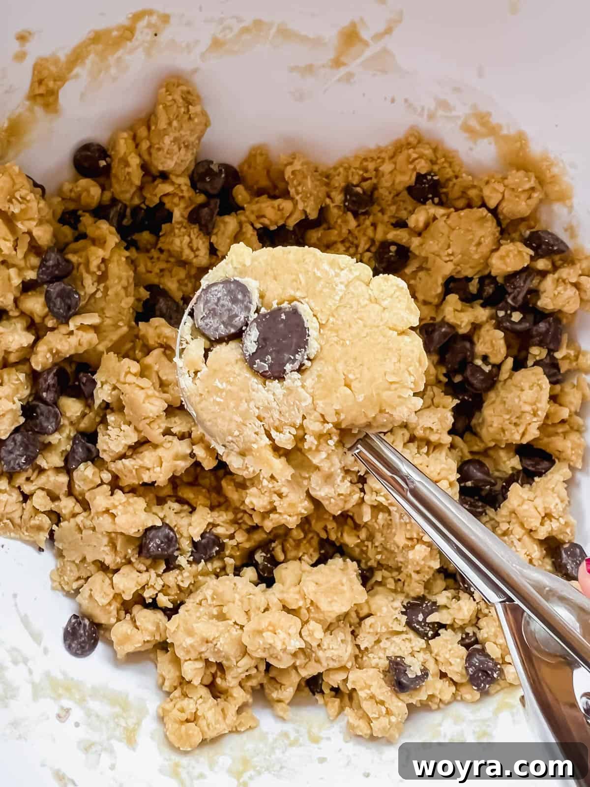 Mediterranean Chocolate Chip Jewels 7 Scooped and rolled cookie dough balls neatly arranged on a baking sheet, prepared for oven baking.