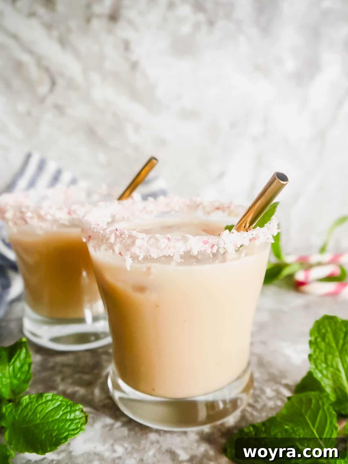 Peppermint Cloud White Russian 2 Two glasses of Peppermint White Russian, garnished with candy canes, ready for holiday celebrations.