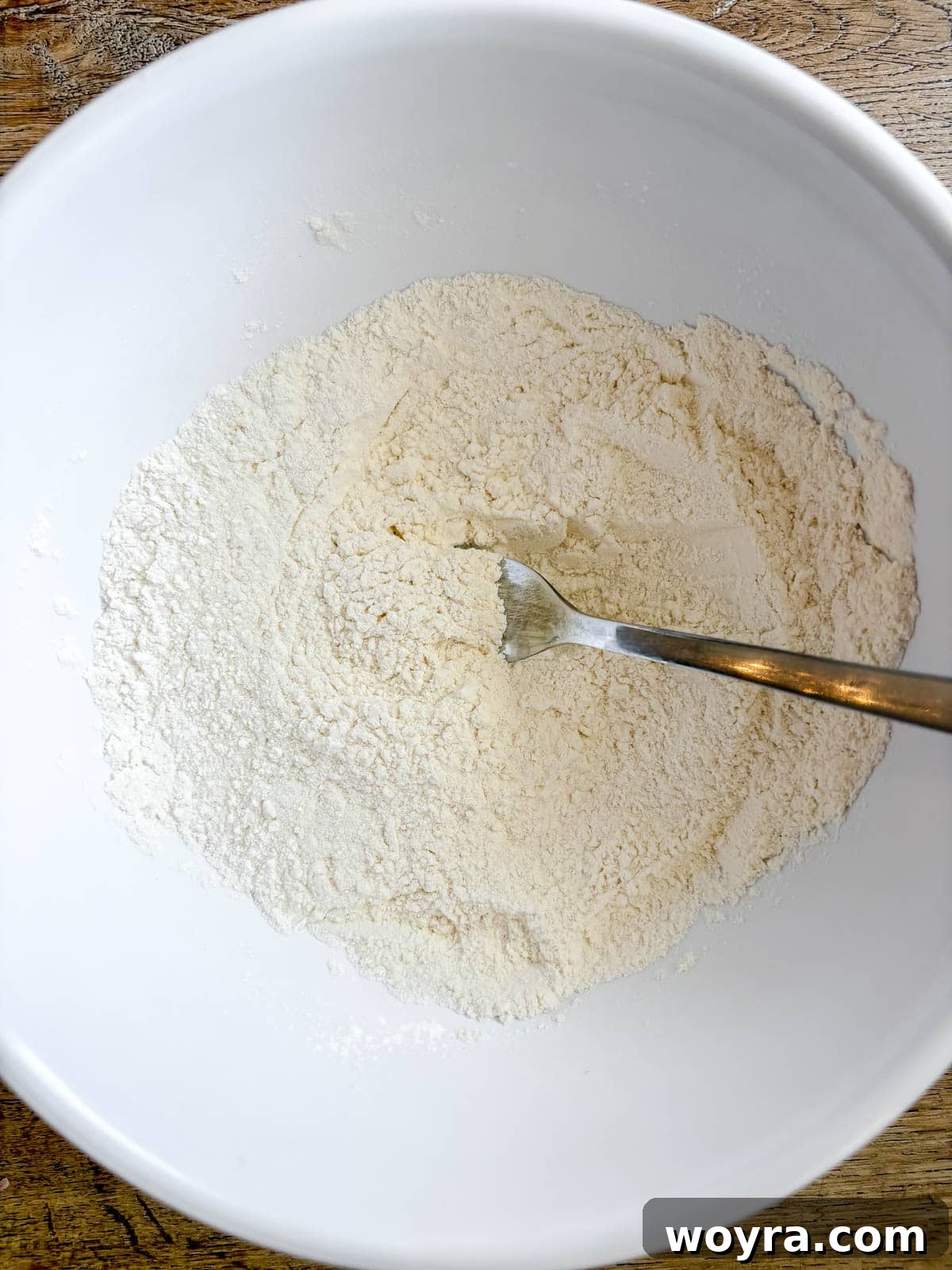 Dairy Free Olive Oil Blueberry Muffins 4 Dry ingredients for muffins in a bowl, ready to be mixed.