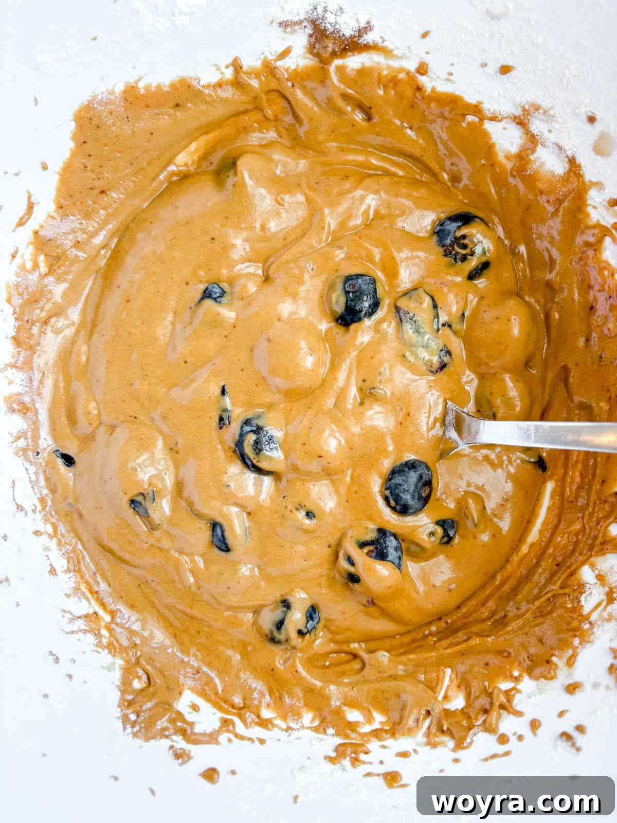 Dairy Free Olive Oil Blueberry Muffins 8 Blueberries folded into the muffin batter.
