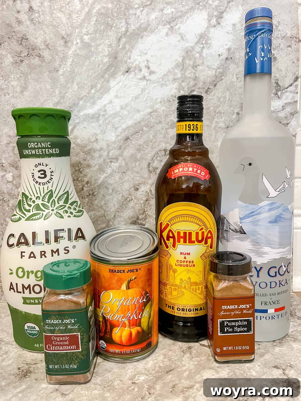 Ingredients for a Pumpkin Spice White Russian laid out on a surface.