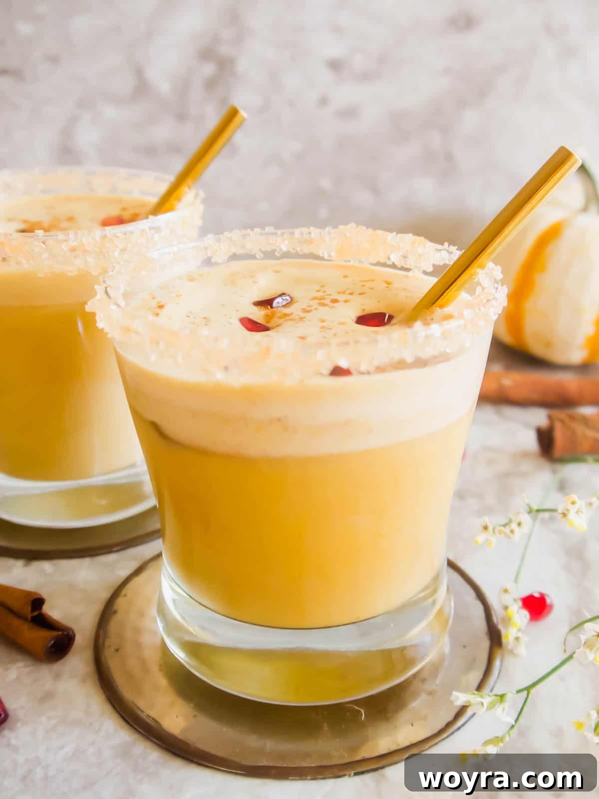 Pumpkin white Russian in cup rimmed with sugar, ready to drink.