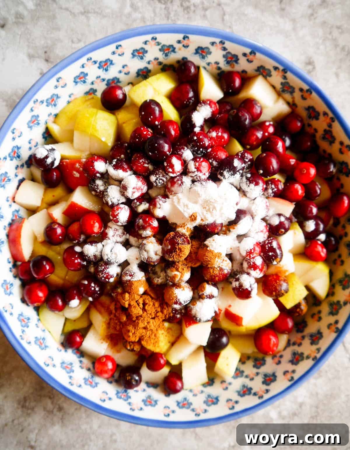 Spiced Pear Cranberry Crumble 5 Diced pears and fresh cranberries mixed with thickening agents and spices in a baking dish before topping.