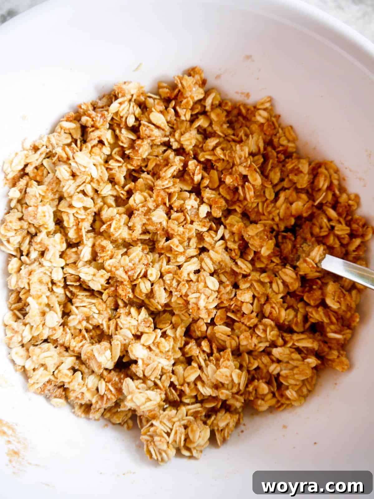 Spiced Pear Cranberry Crumble 6 Almond flour and rolled oat topping mixture in a bowl, ready to be sprinkled over fruit.