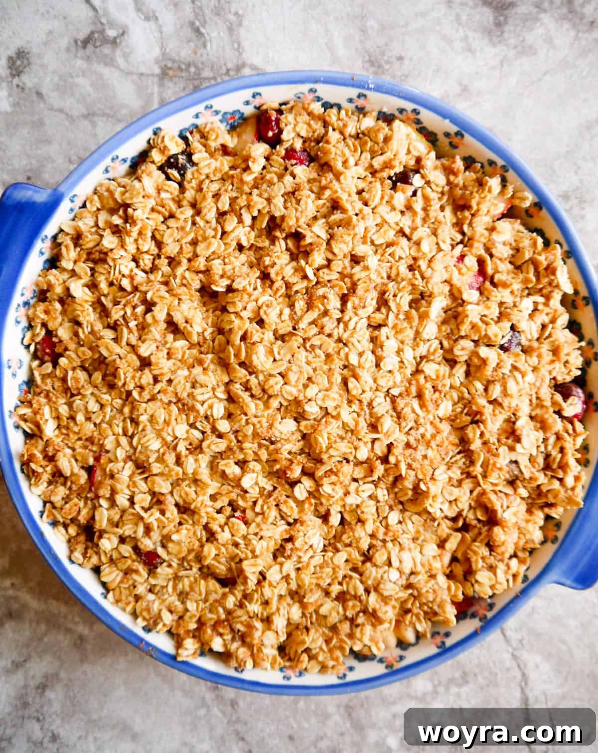 Spiced Pear Cranberry Crumble 7 Gluten-free Pear Cranberry Oatmeal Crisp assembled in a baking dish, before it goes into the oven.