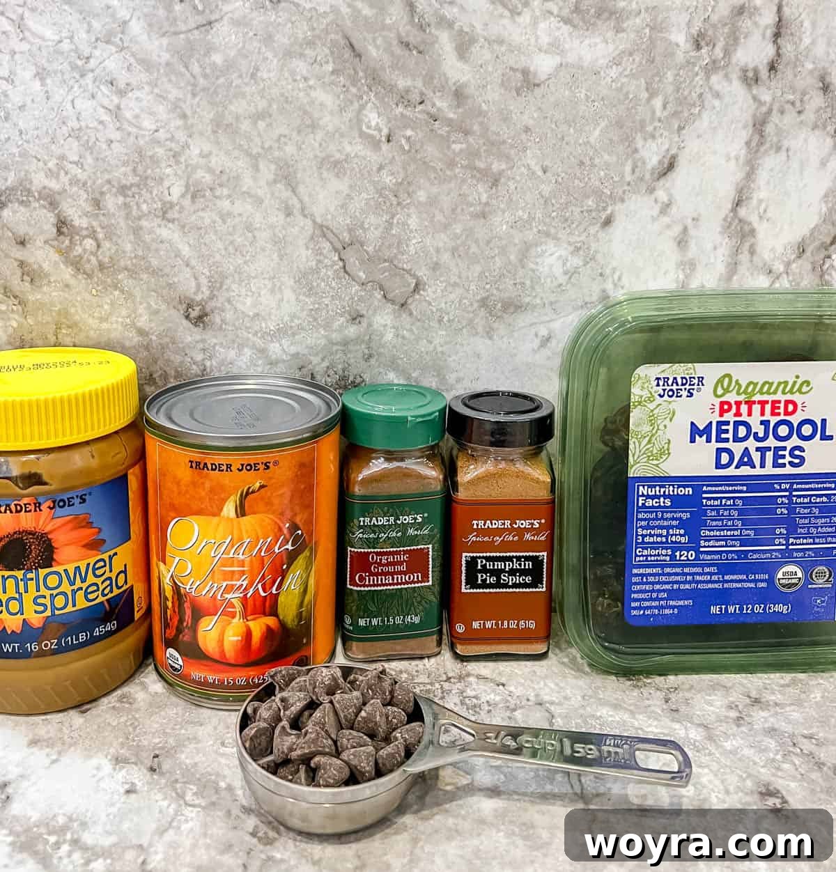 Pumpkin Spice & Chocolate Date Bites 4 A neatly arranged selection of fresh and pantry ingredients needed to make homemade pumpkin stuffed dates, including dates, pumpkin puree, and spices.