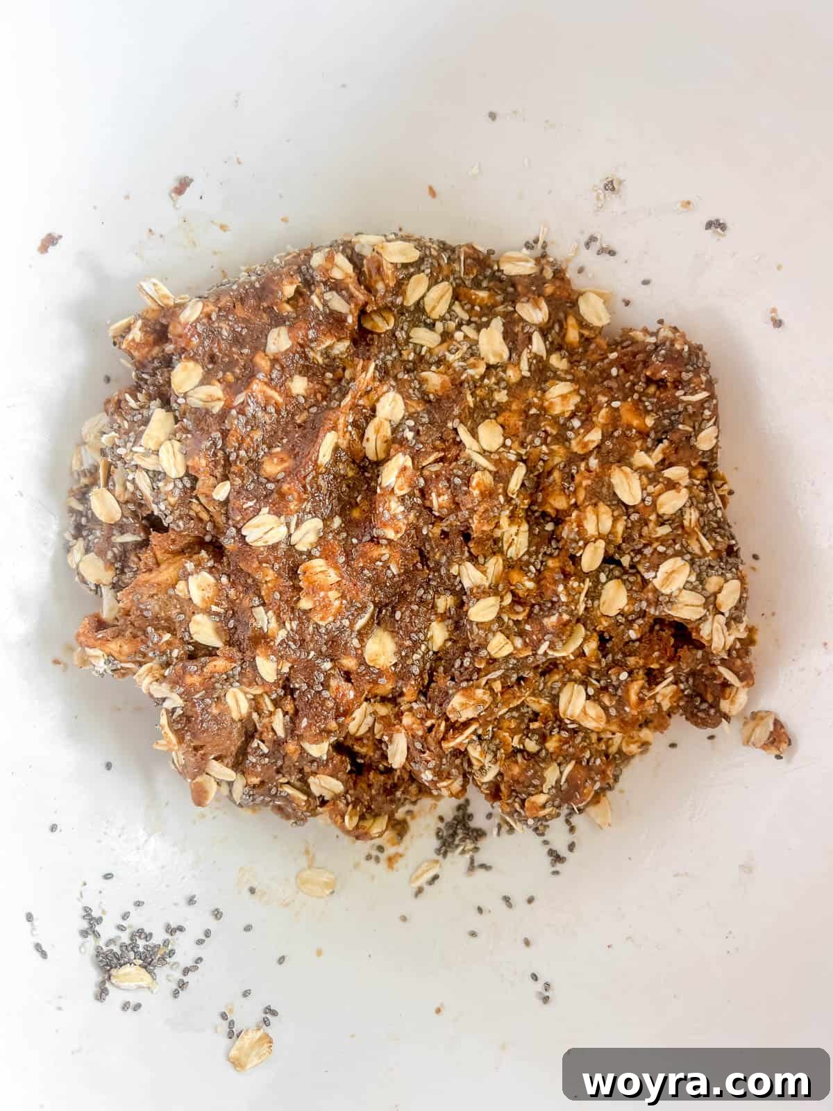 The oat and date mixture has been thoroughly combined, forming a cohesive apple ball dough.