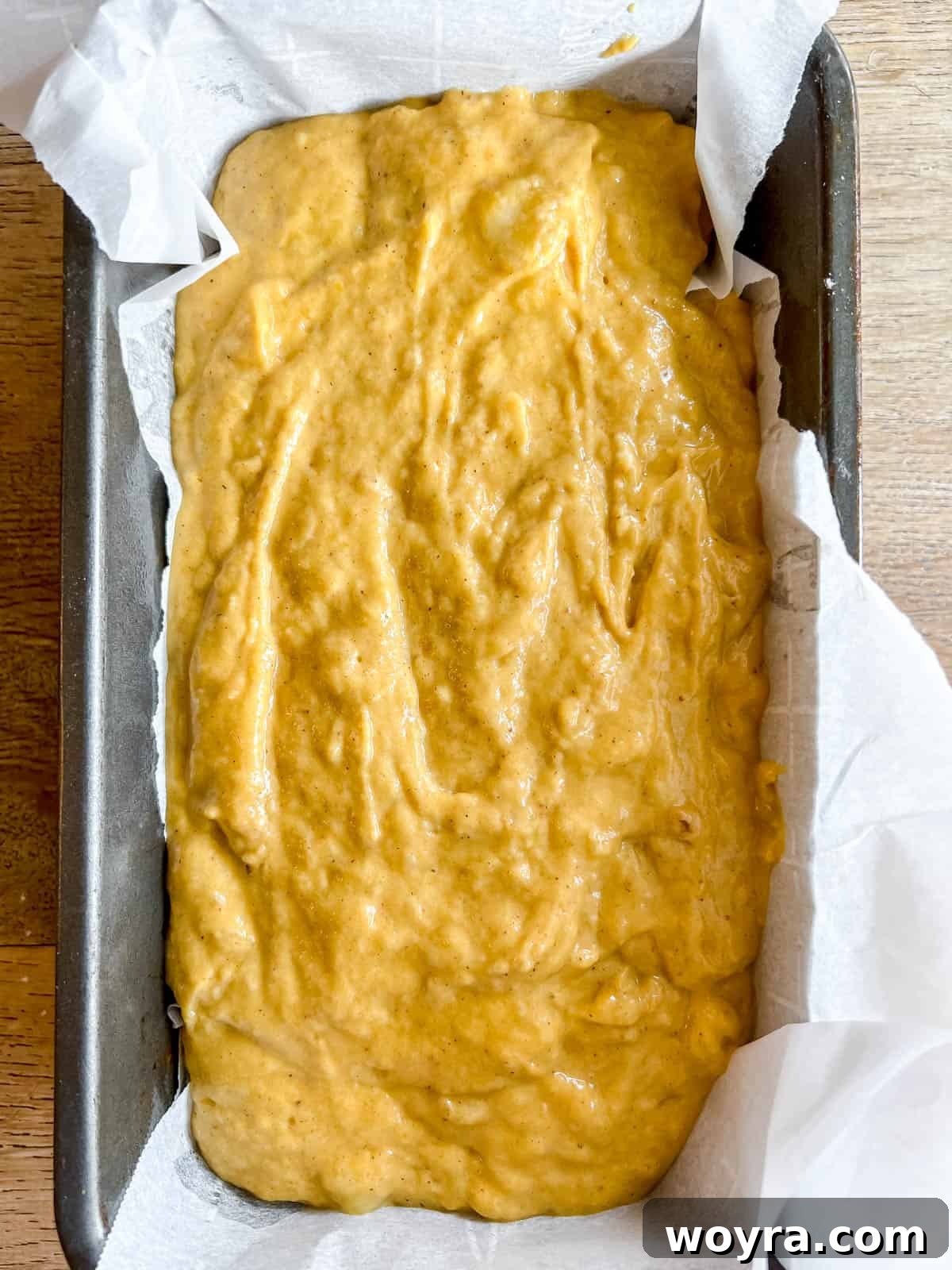 Wholesome Plant-Based Pumpkin Banana Bread 8 Pumpkin banana bread batter poured into a loaf tin before baking.