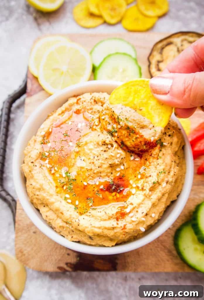 Creamy Mediterranean Cauliflower Hummus Paleo Gluten Free 6 Ingredients being blended into a creamy Mediterranean Cauliflower Hummus.