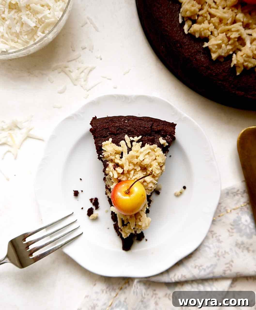 Paleo German Chocolate Cake 3 Close-up of the delicious Paleo German Chocolate Cake, showing its moist chocolate layers and rich, textured coconut caramel frosting. Gluten-free and dairy-free.