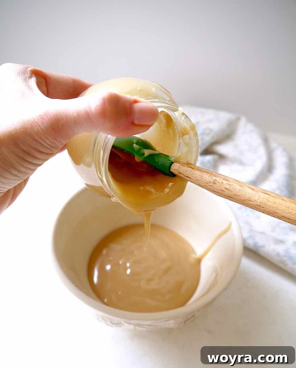 Paleo German Chocolate Cake 4 Making Paleo Caramel Sauce in a saucepan, the first step for the German Chocolate Cake topping.