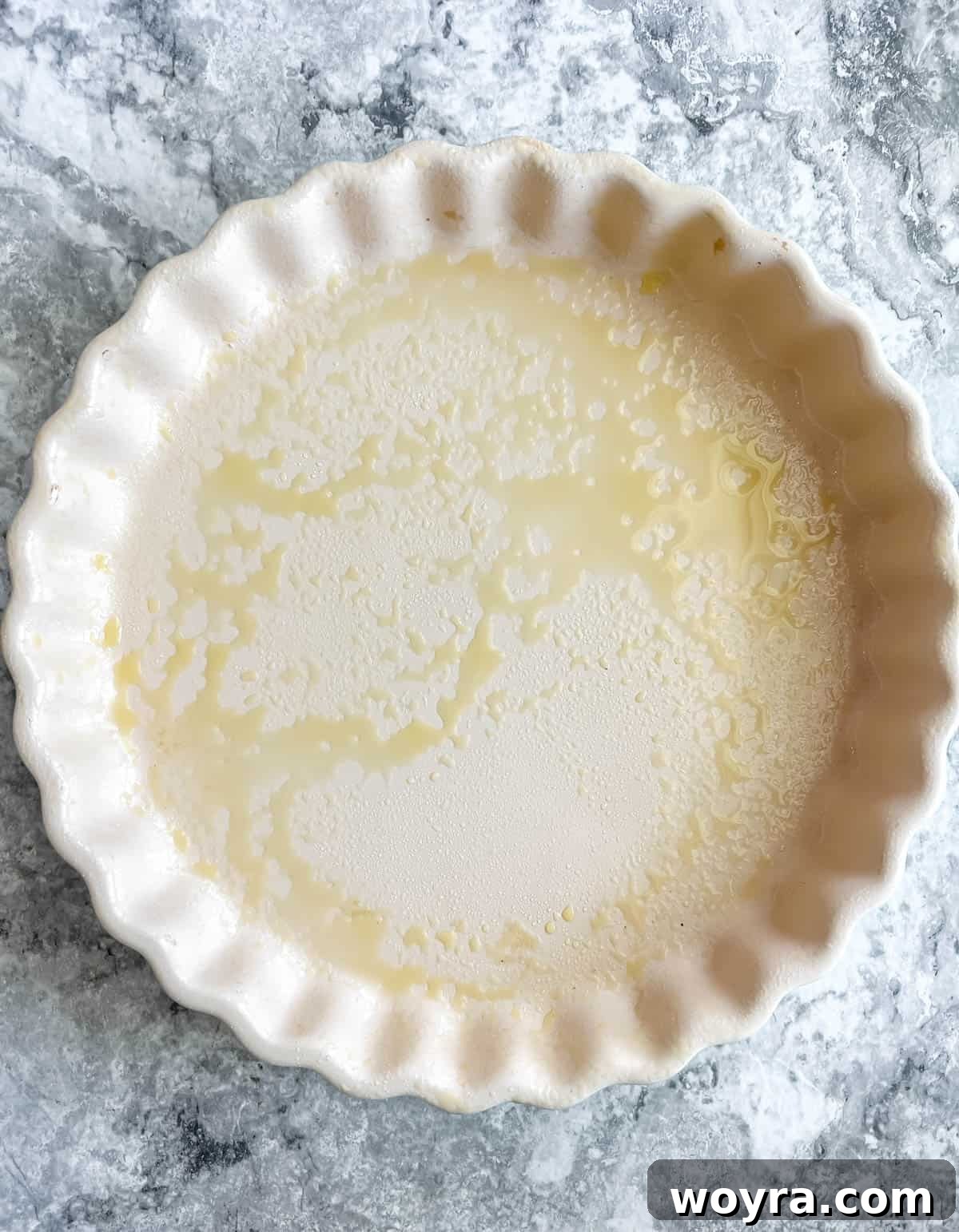 Effortless Apricot Tart 4 A greased tart pan, ready for the pie crust.