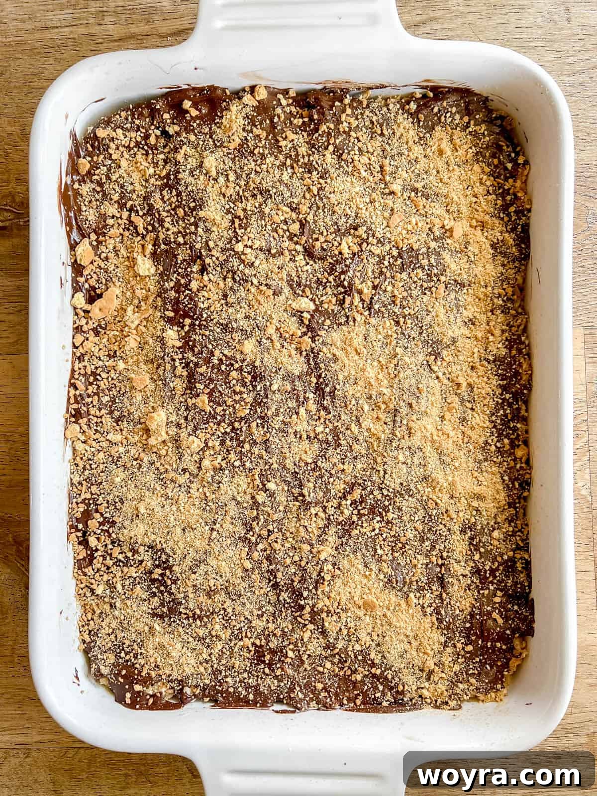 Campfire S'mores Krispie Bars 14 Remaining crushed graham crackers are sprinkled generously over the melted chocolate topping on the S'mores Rice Krispie Treats.
