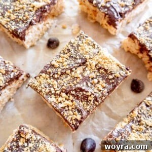 S'mores rice krispie treats cut into squares on parchment paper.
