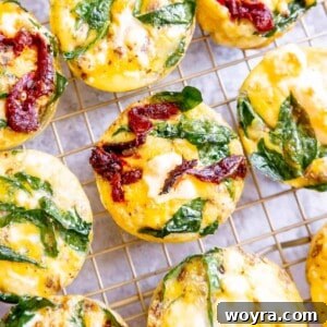 Spinach feta egg cups cooling on a drying rack.