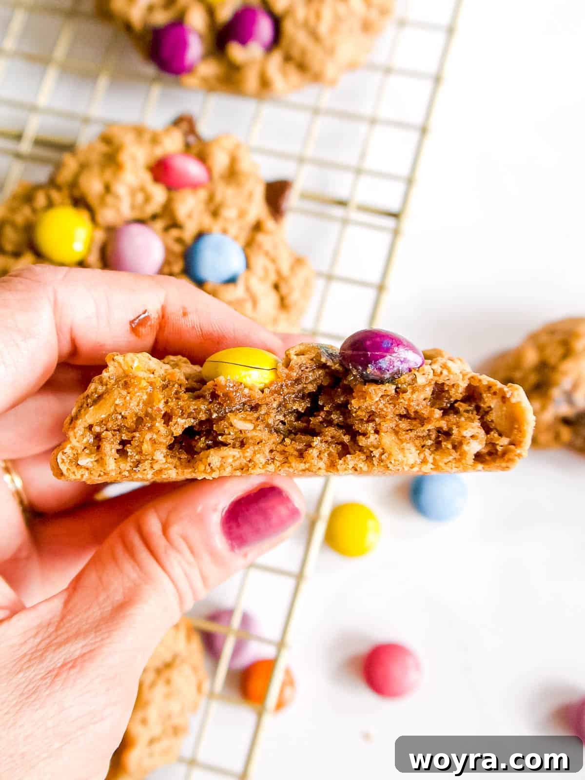 Giant Gluten-Free Flourless Almond Butter Cookies 3 A delicious flourless monster cookie with a bite taken out, showcasing its rich texture and chocolate inclusions.