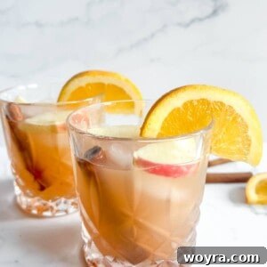Apple Cider Whiskey Cocktail in two cups, ready to be served.