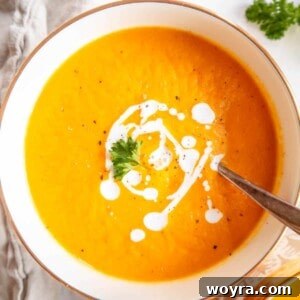 Butternut squash and carrot soup in a bowl.