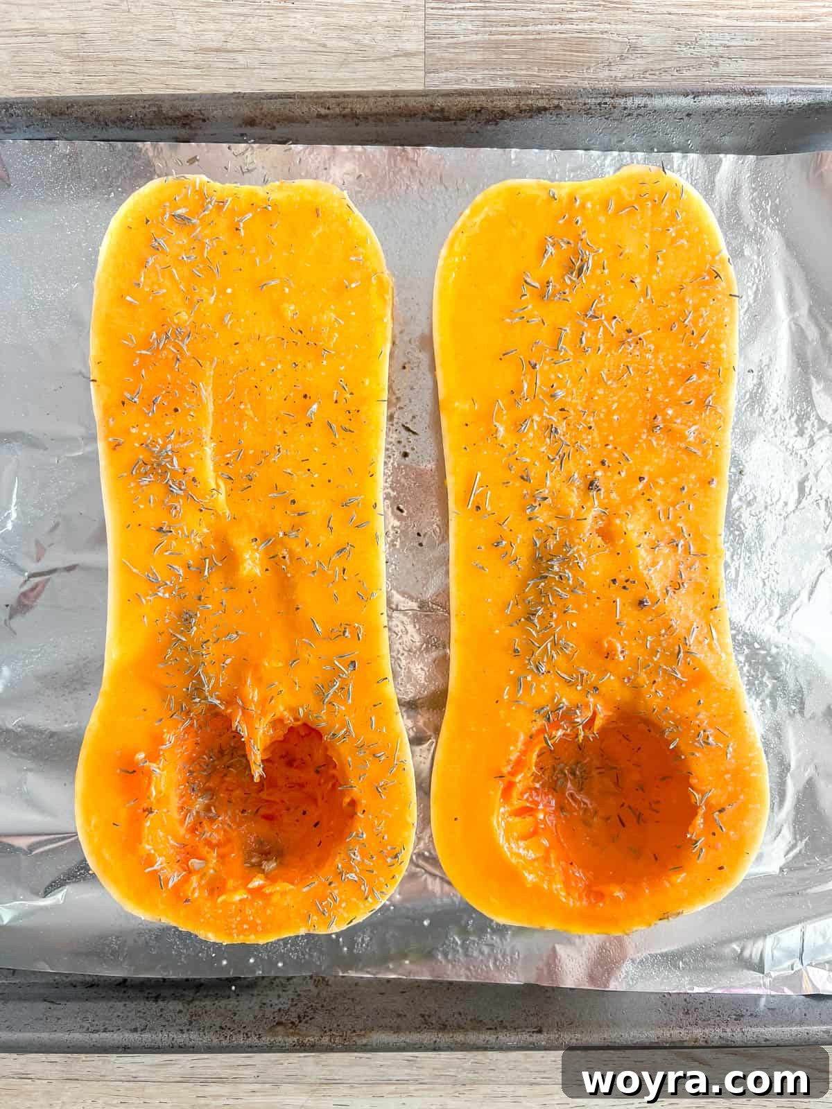 Butternut squash cut in half before baking.