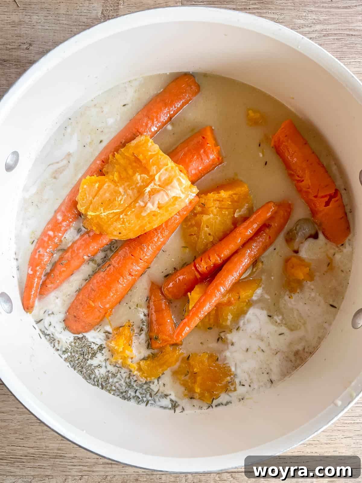 All the roasted soup ingredients combined in a soup pot.