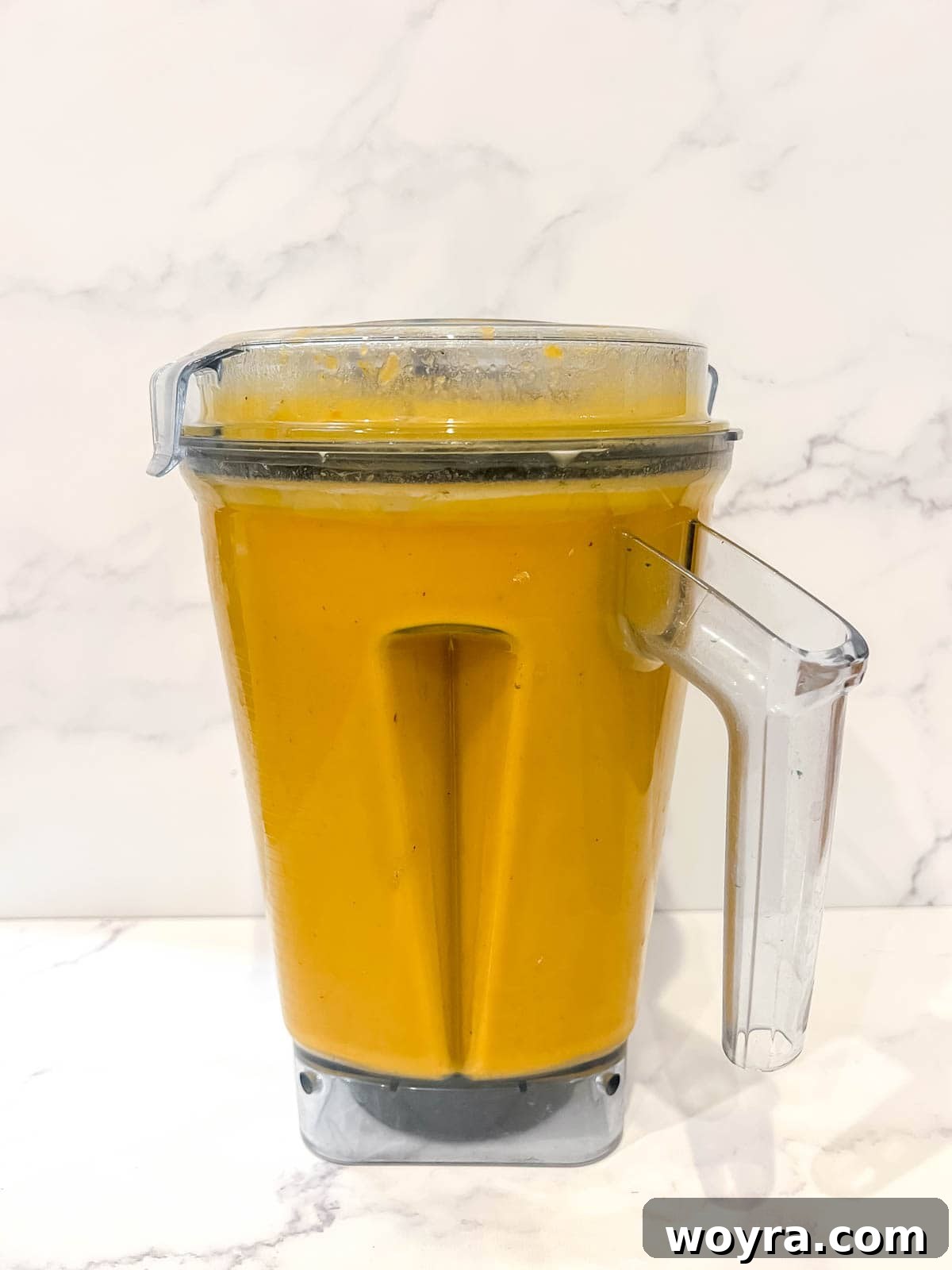 The soup in a blender after being mixed to a smooth consistency.