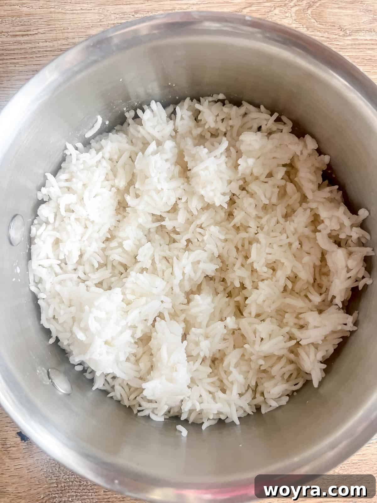 Dynamite Salmon Rice Bowl 7 White rice cooking in a pot on the stove.