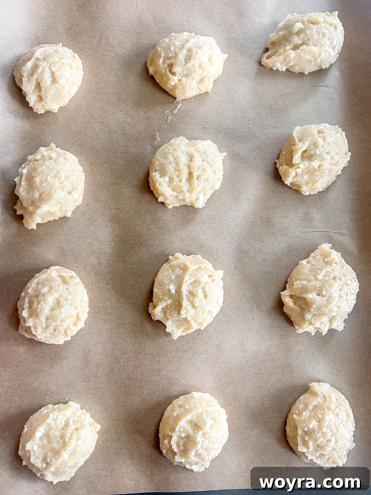 Wholesome Cottage Cheese Cookies 11 Scooped cottage cheese sugar cookie dough balls on a baking sheet before baking.