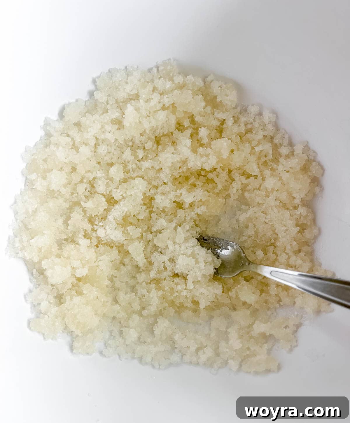 Wholesome Cottage Cheese Cookies 6 Cane sugar and olive oil being mixed together in a large bowl.
