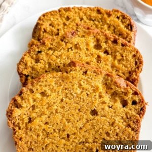 Slices of dairy-free pumpkin bread on a plate.