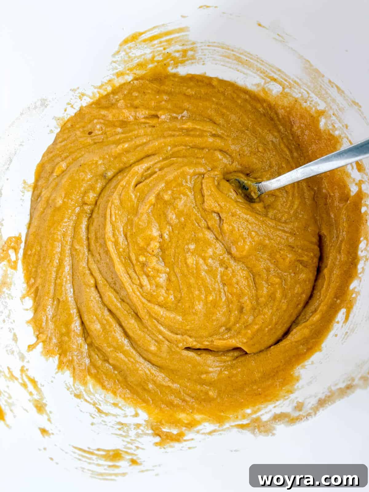 The dairy-free pumpkin batter fully mixed to a smooth consistency.