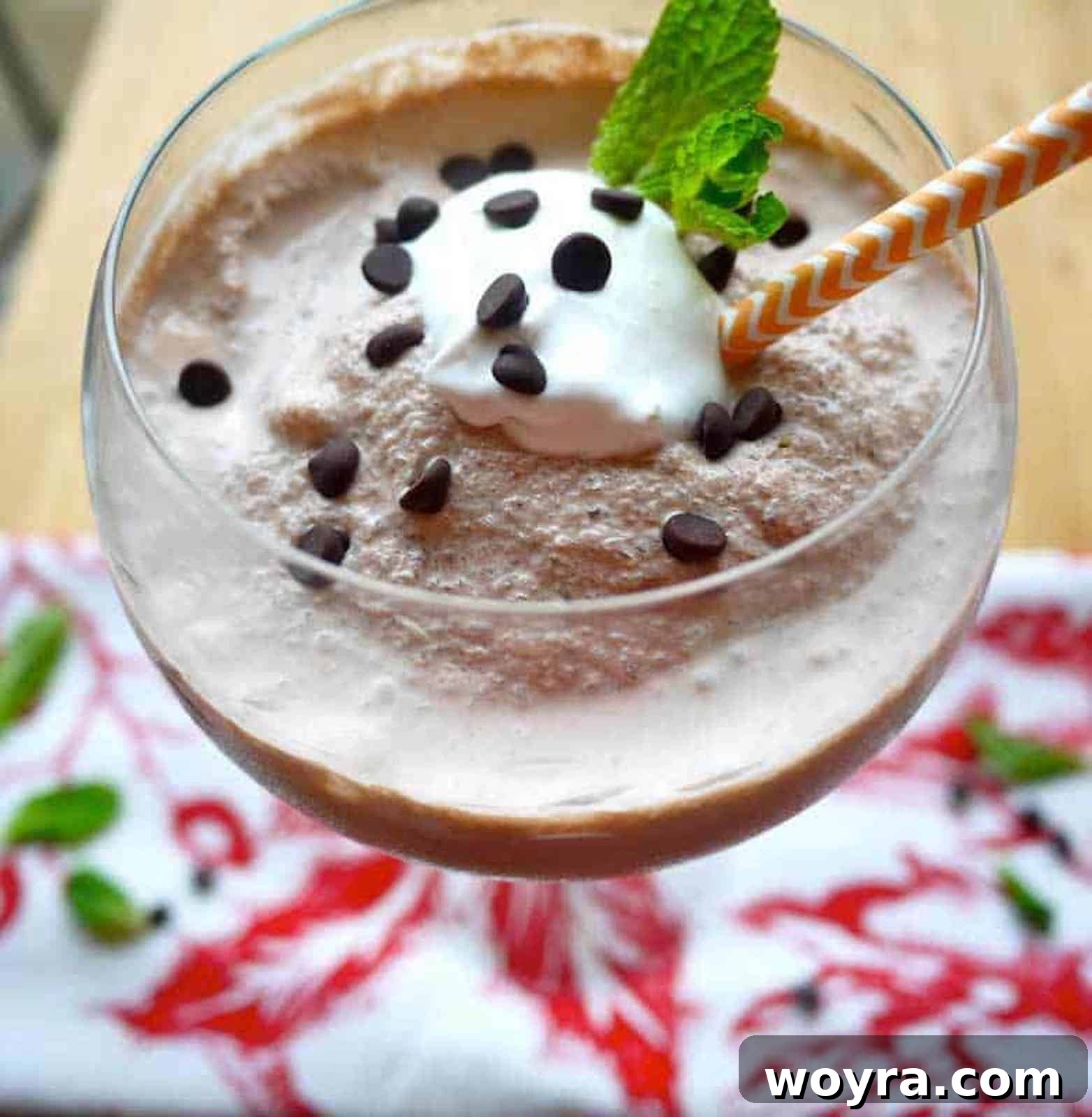 Creamy Paleo Dairy Free Frozen Hot Chocolate 4 Dairy-free frozen hot chocolate with a swirl of dairy-free whipped cream and a sprinkle of chocolate shavings.