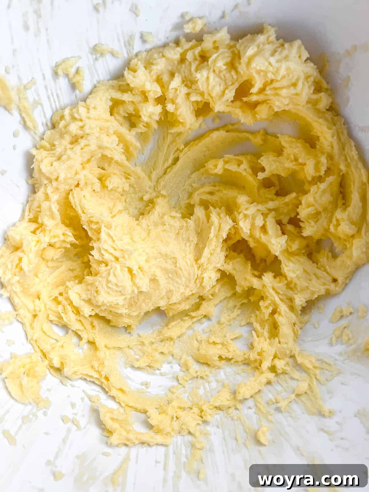 Perfectly Shaped Sable Delights 5 Vanilla extract and a large egg added to the creamed butter and sugar mixture.