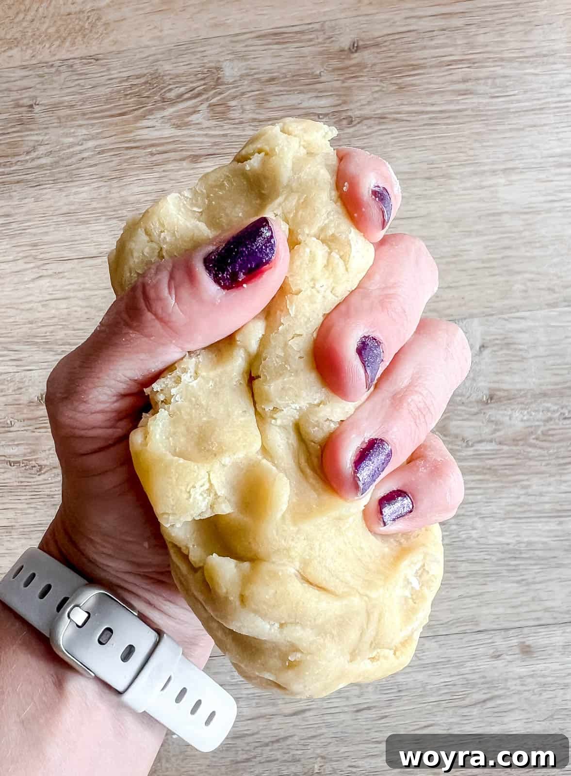 Perfectly Shaped Sable Delights 10 Softening refrigerated sable cookie dough by working it in your hands.