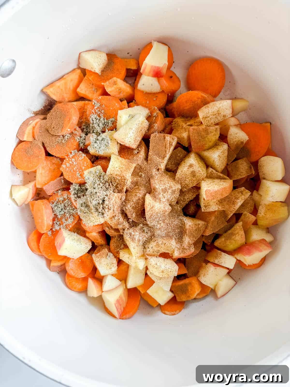 Orchard Spice Turkey Chili 4 Diced apples, sliced carrots, and quartered sweet potatoes simmering in a pot with a blend of spices.