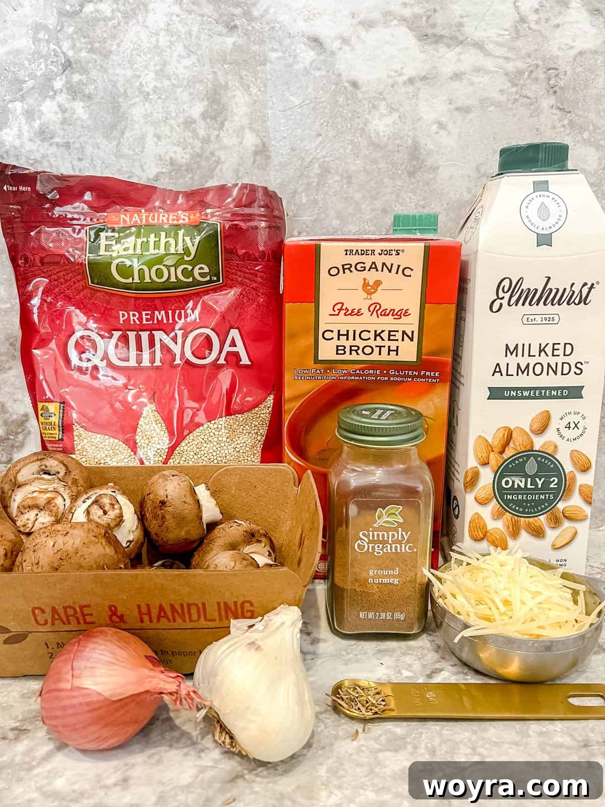 Velvety Mushroom Quinoa Risotto 4 A flat lay of all the fresh ingredients needed to prepare the Mushroom Quinoa Risotto, including quinoa, shallots, garlic, mushrooms, and herbs.