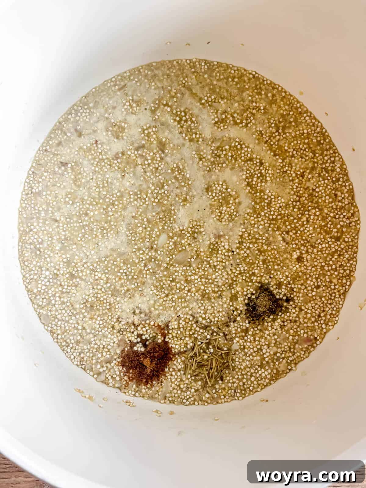 Velvety Mushroom Quinoa Risotto 9 Ground nutmeg, dried rosemary, salt, and pepper sprinkled over the cooking quinoa risotto.