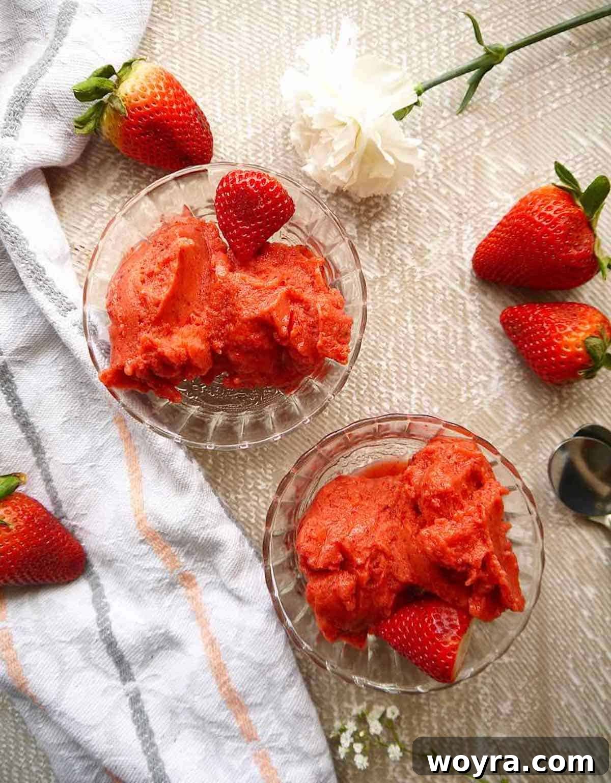 Strawberry Mango Blender Sorbet 4 A close-up shot of a vibrant pink and orange strawberry mango sorbet with a smooth, firm texture, ready to be served.