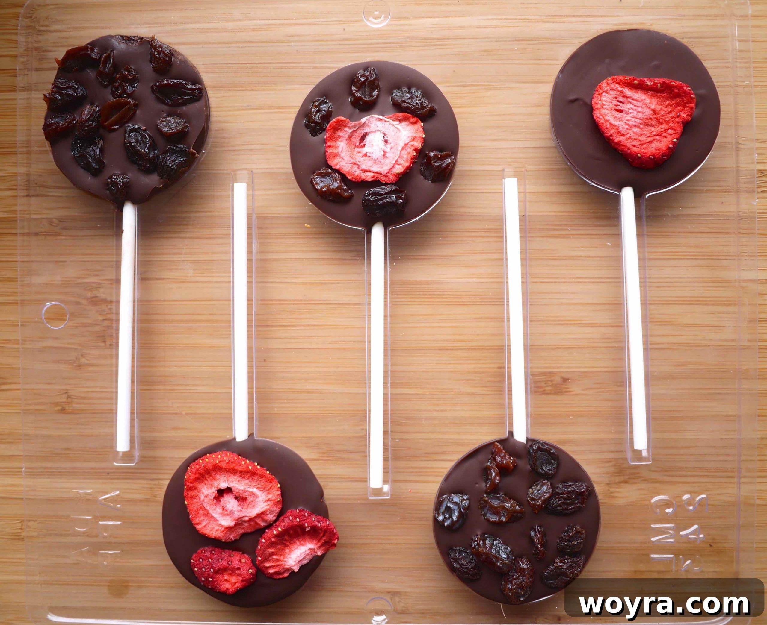 Artisan Chocolate Fruit Pops 8 The finished chocolate lollipops, fully set and removed from their molds, ready to be enjoyed or packaged.