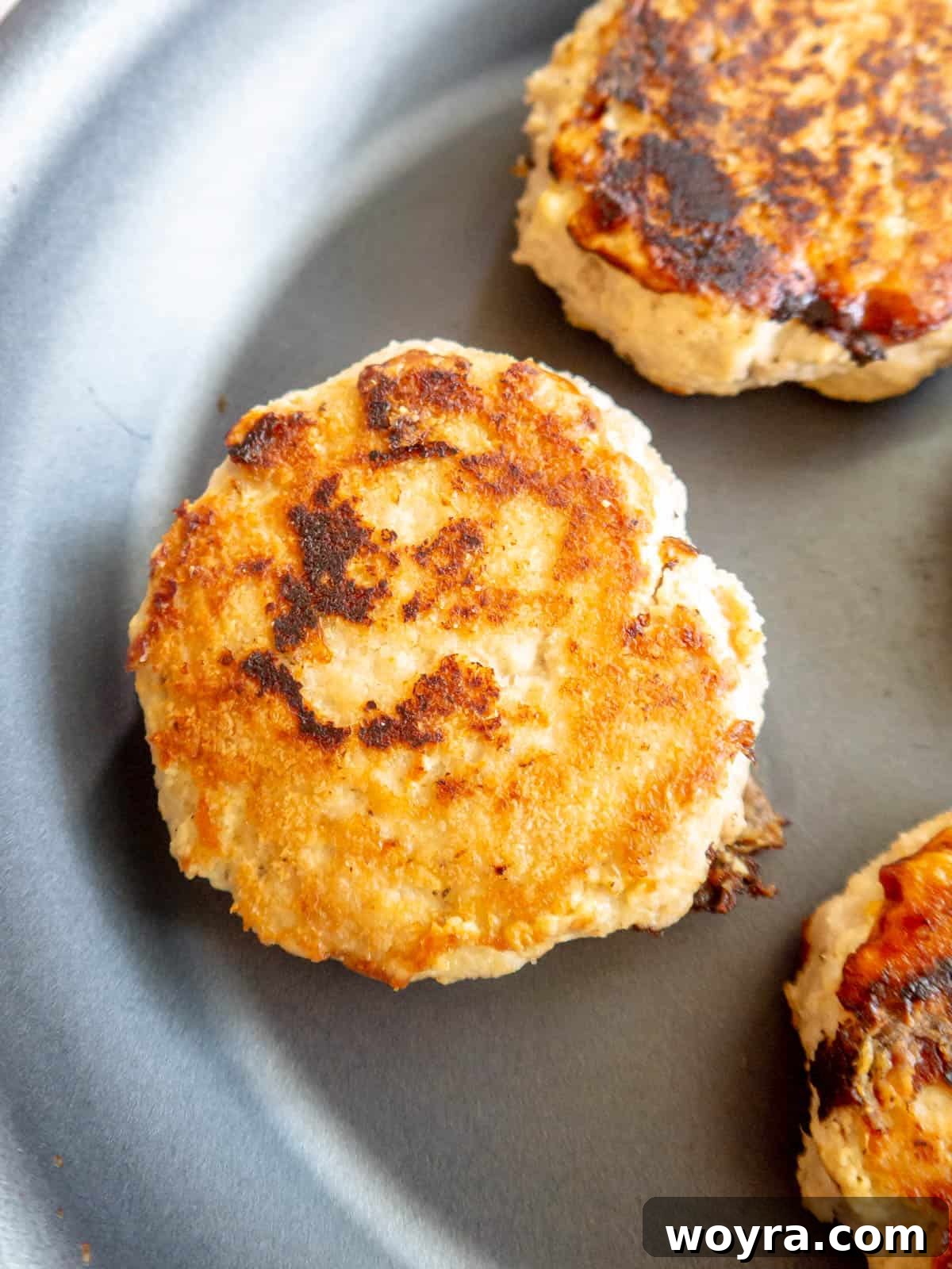 A perfectly golden chicken burger patty, cooked to perfection.