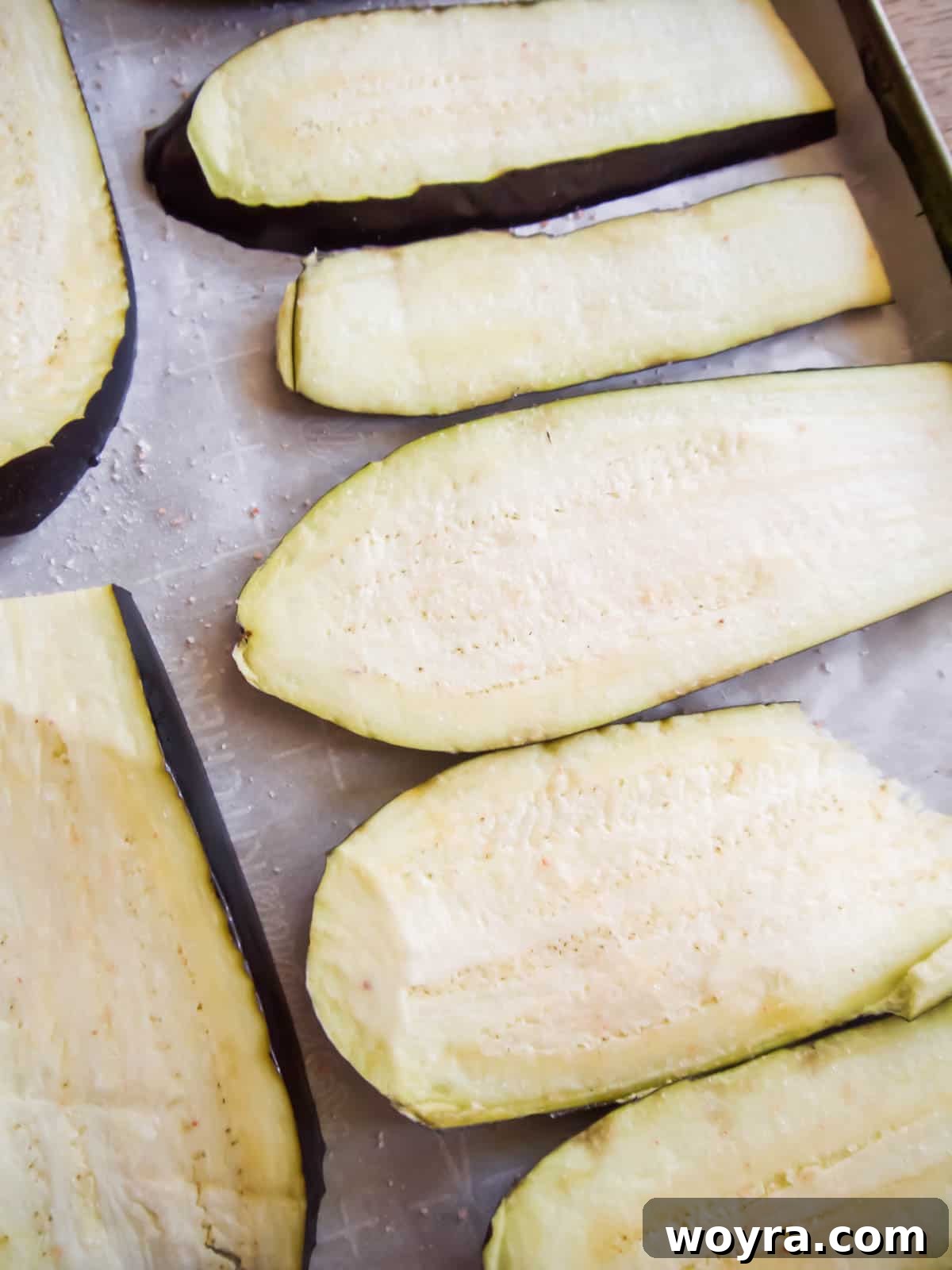 Rustic Turkey and Veggie Gratin 4 Thinly sliced eggplant generously salted on a tray, allowing it to 'sweat' out excess moisture before cooking.