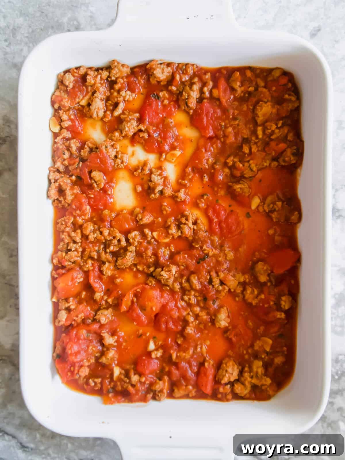 Rustic Turkey and Veggie Gratin 5 A savory ground turkey meat sauce simmering in a pan, ready to be layered into the casserole dish.