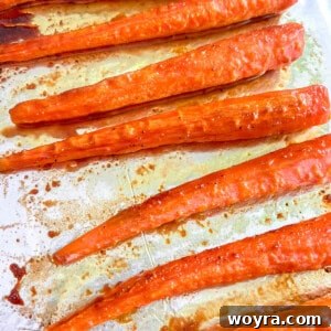Turmeric maple glazed carrots fresh out of the oven, ready to be served as a side dish.