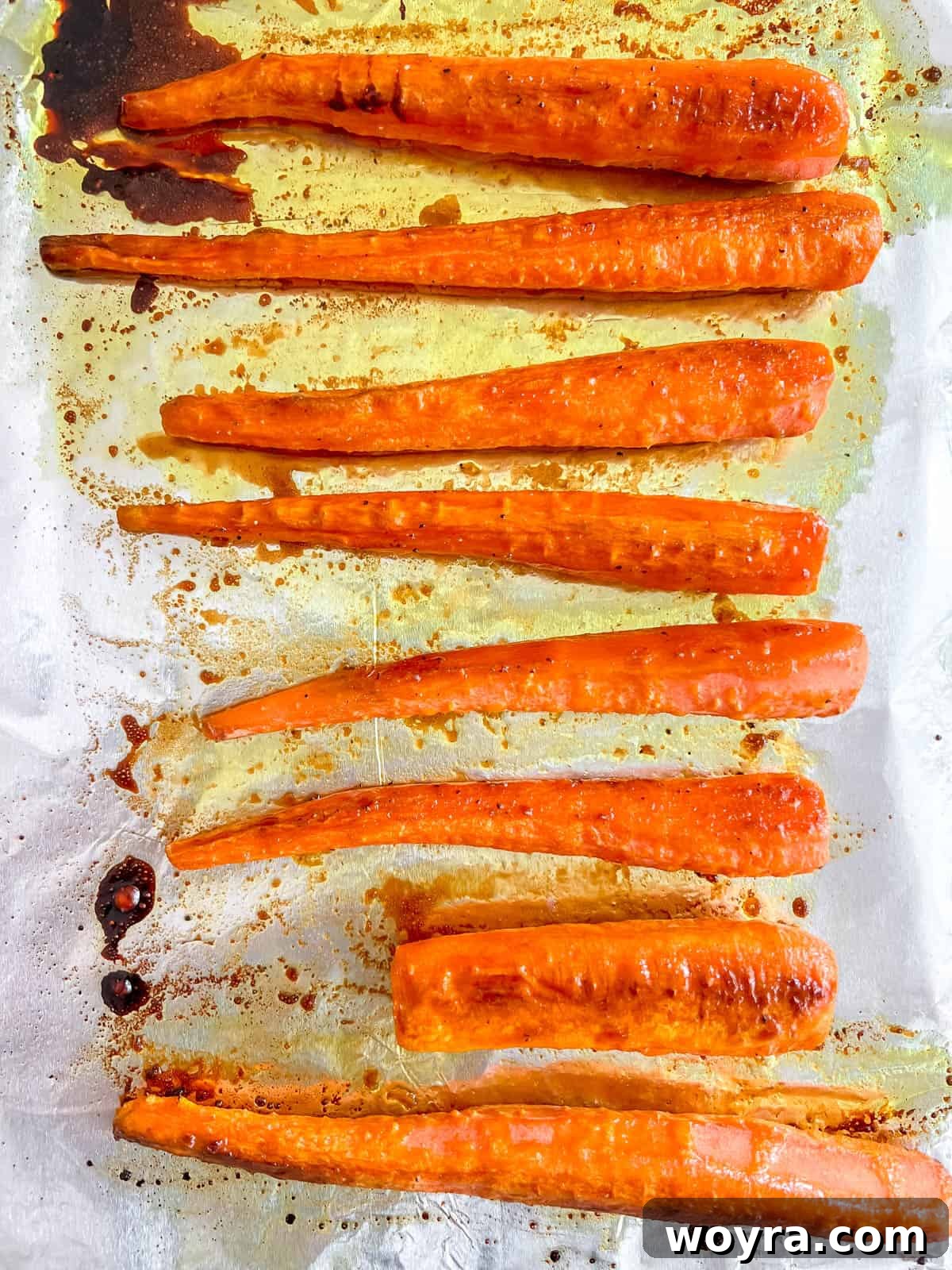 Perfectly roasted maple syrup glazed carrots, golden brown and tender after baking.