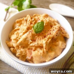 Red Coconut Curry Pulled Chicken in a recipe card format image.