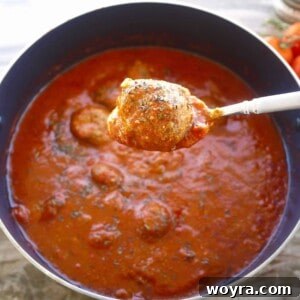 Savory Almond Flour Meatballs with Rich Sauce 10 Almond flour meatballs in a large pot, ready to be served.