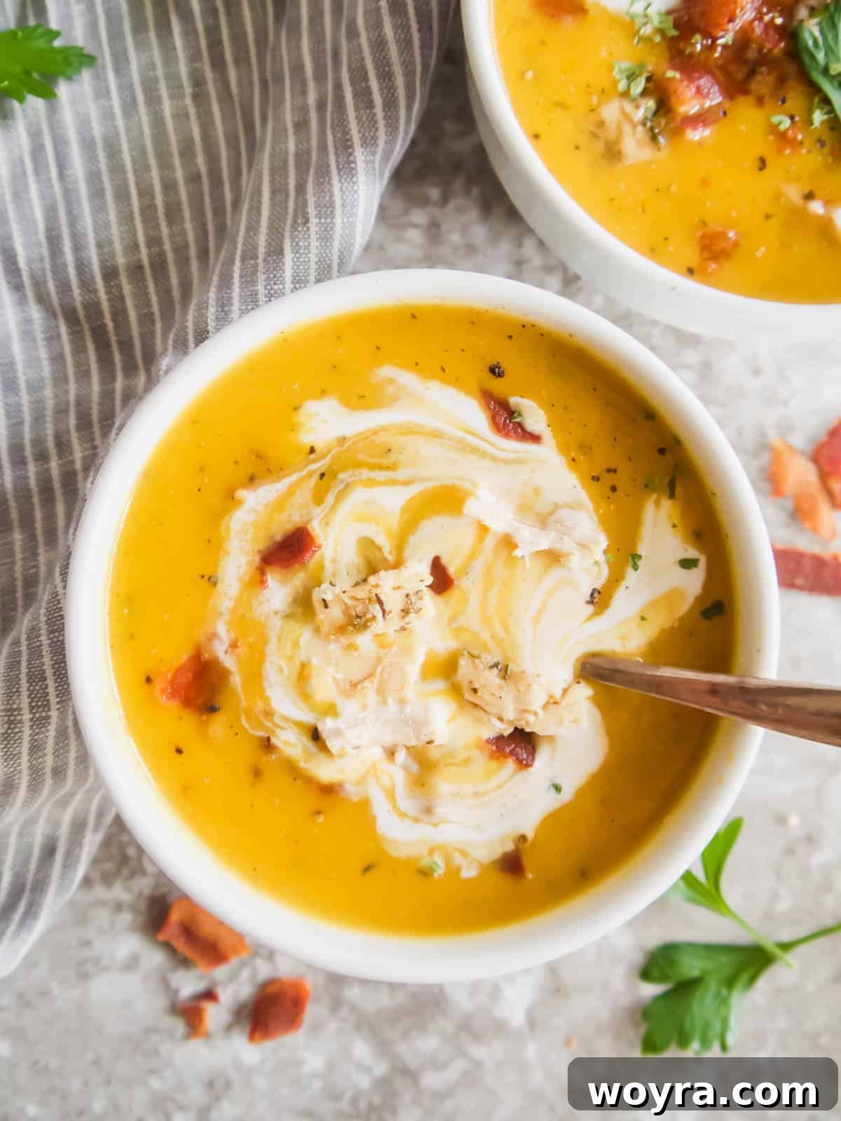 Golden Butternut Chicken Comfort 9 Butternut squash soup with bacon and chicken inside of it.